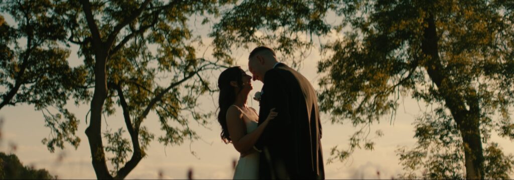 Bride and groom at golden hour outside Reymerston Hall Norfolk Wedding