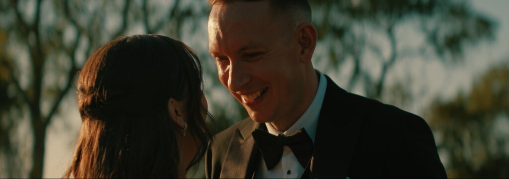 Bride and groom at golden hour outside Reymerston Hall Norfolk Wedding