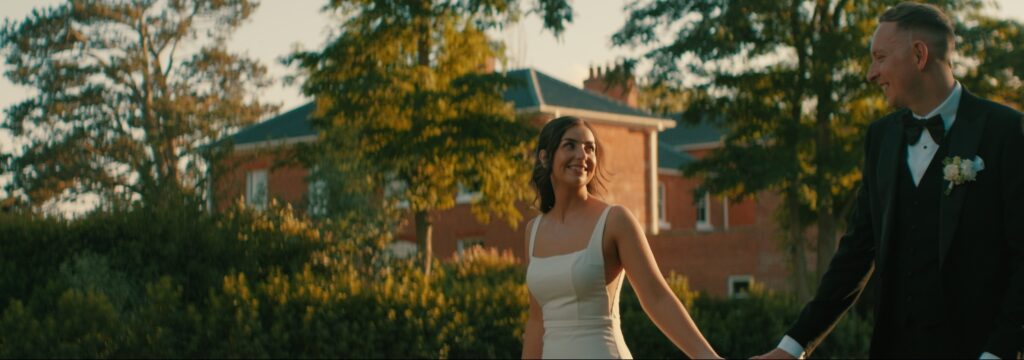Caitlin & Ethan at golden hour outside Reymerston Hall Norfolk Wedding