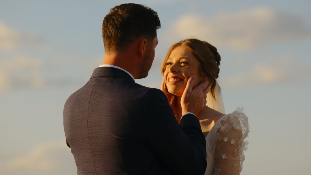 Bride and groom at golden hour on Brancaster beach in Norfolk